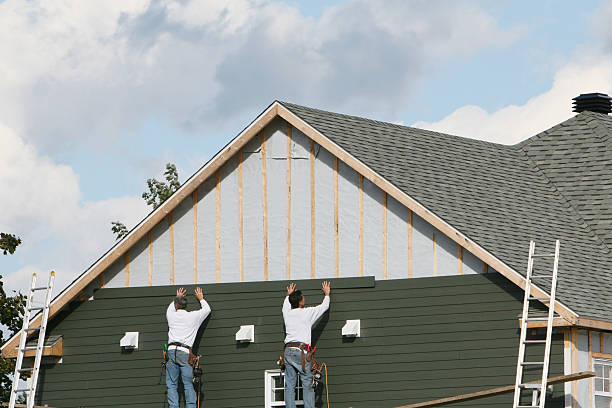 Professional Storm Damage Siding Repair technician working in Westbury, NY